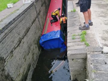 Tarpaulin placed over front entrance to keep water out